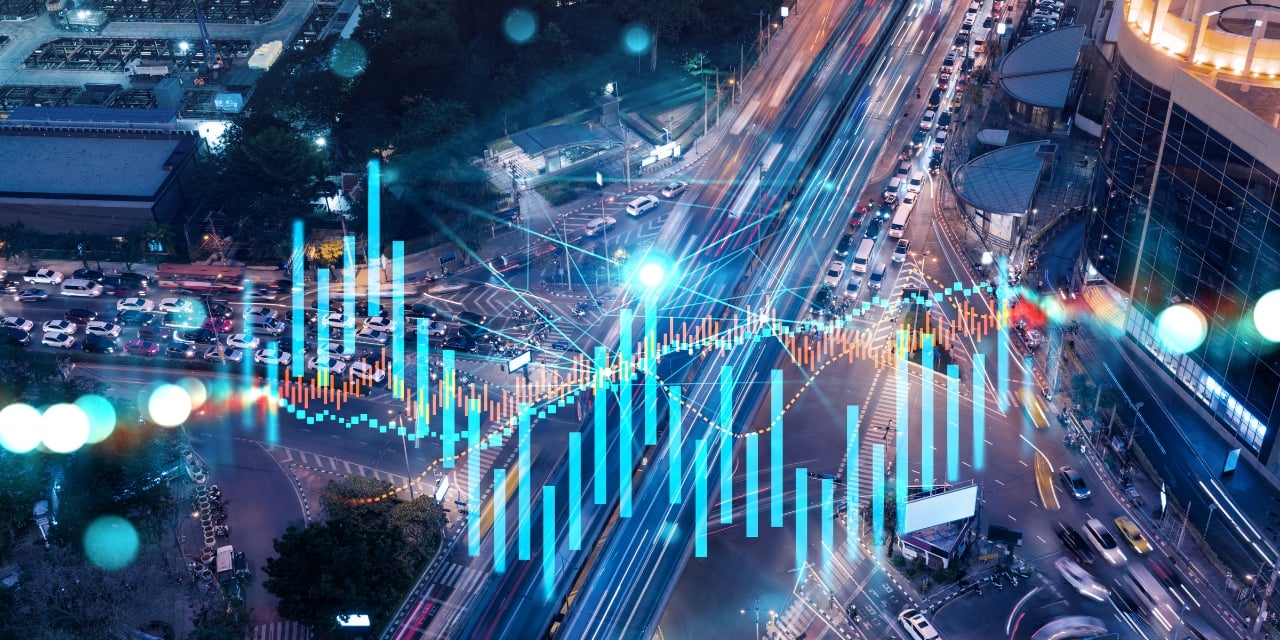 Tehcnology graphic over a photo of a city