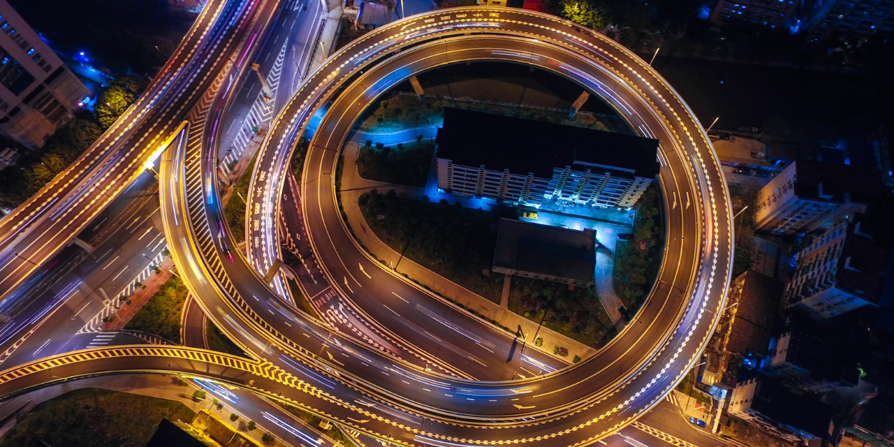 Arial view of a highway system at night.