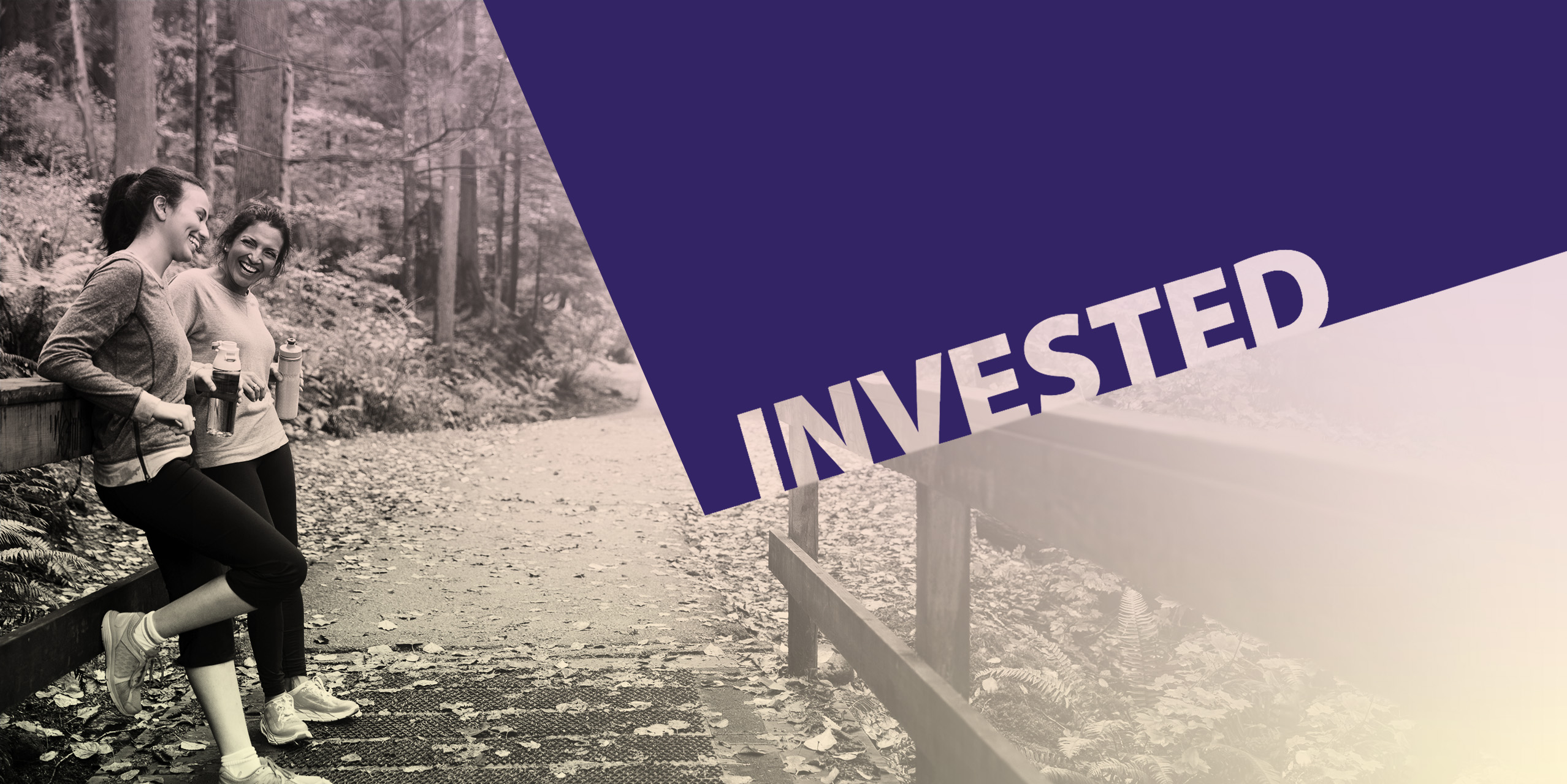 Two women engaged in conversation on a hiking path with the word Invested overlaid in a purple shape
